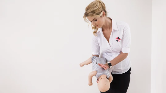 Woman treating Choking Baby